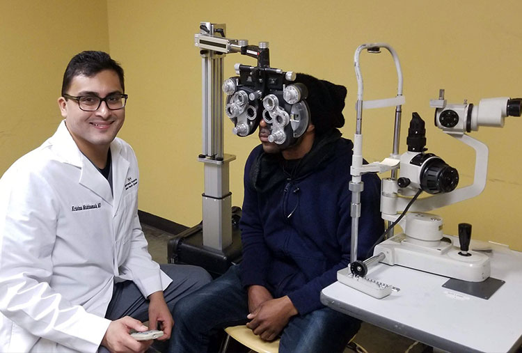 Dr. Krishna Mukkamala with a patient.